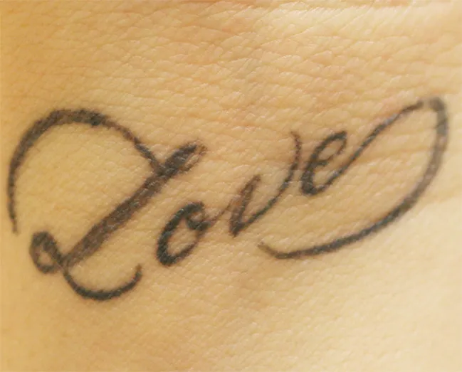 Script 'Love' — tattoo before laser removal treatment